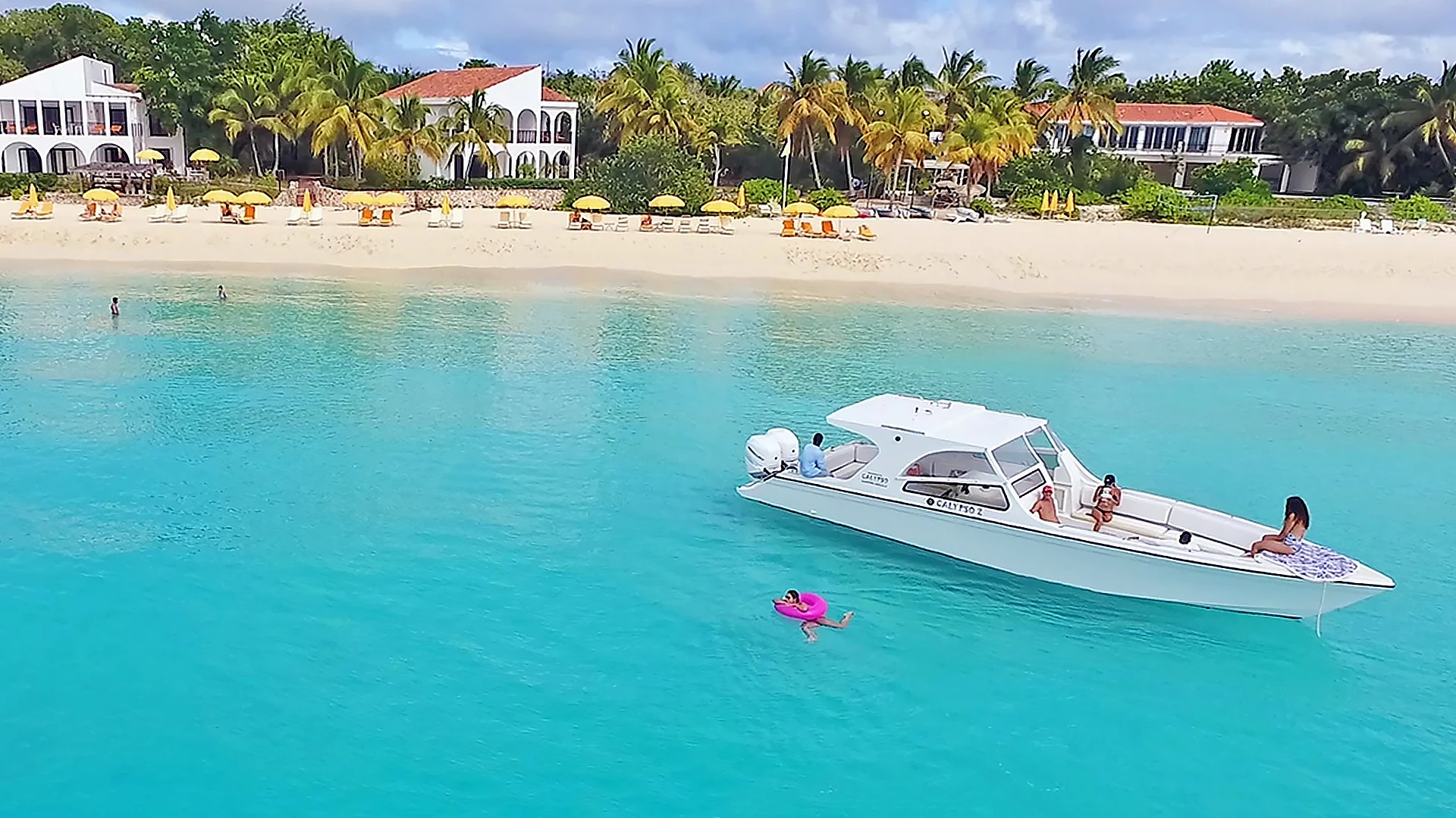 Calypso 38-foot Bowrider anchored in the turquoise waters off Meads Bay during a private Anguilla boat charter.